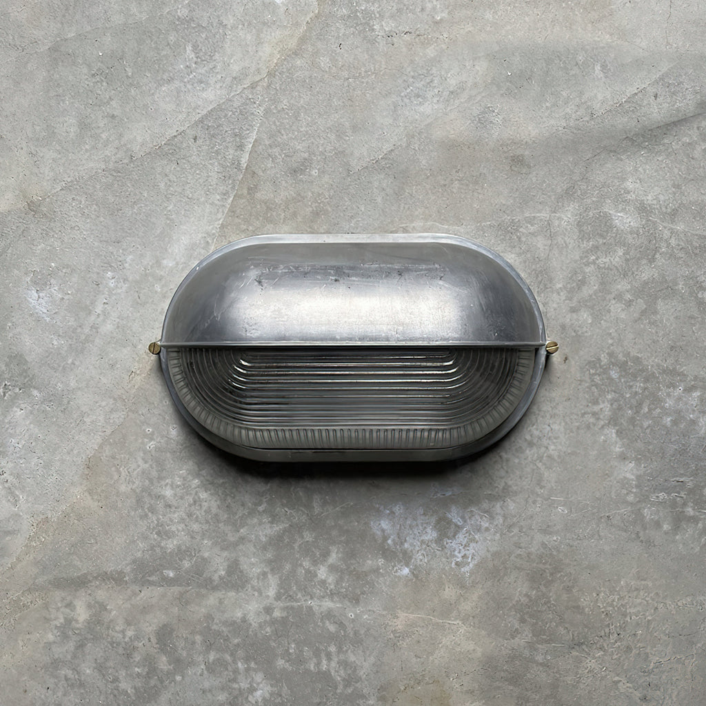 Przemysłowa lampa ścienna typu bulkhead | Ormexis