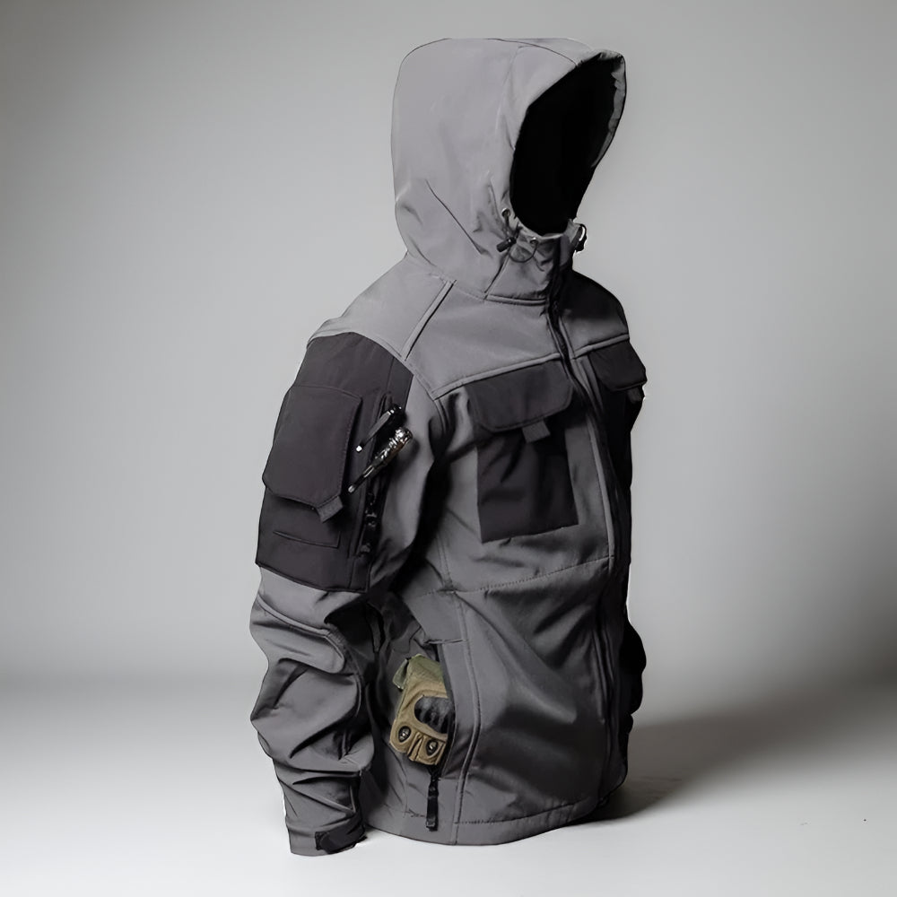 Taktisk udendørs sæt med robuste bukser og arbejdsjakke til barske miljøer