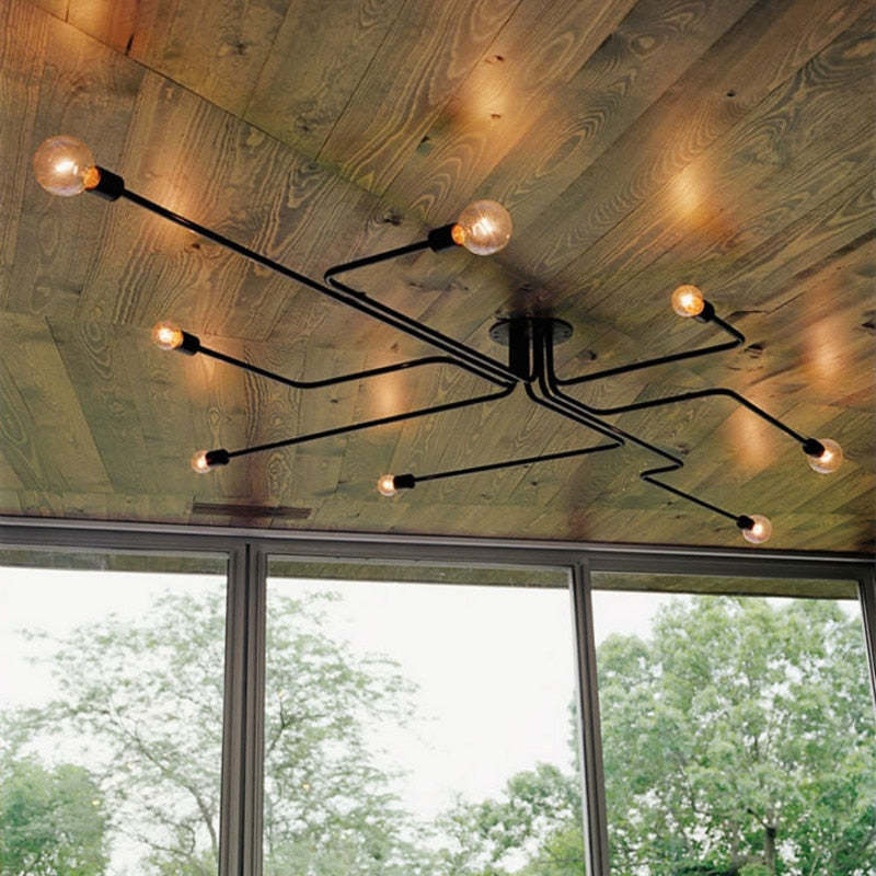 Schwarze Sputnik-Deckenleuchte aus Metall im Industrie- und Mid-Century-Stil mit mehreren Armen und sichtbaren Glühbirnen, flache Deckenmontage | Ormexis