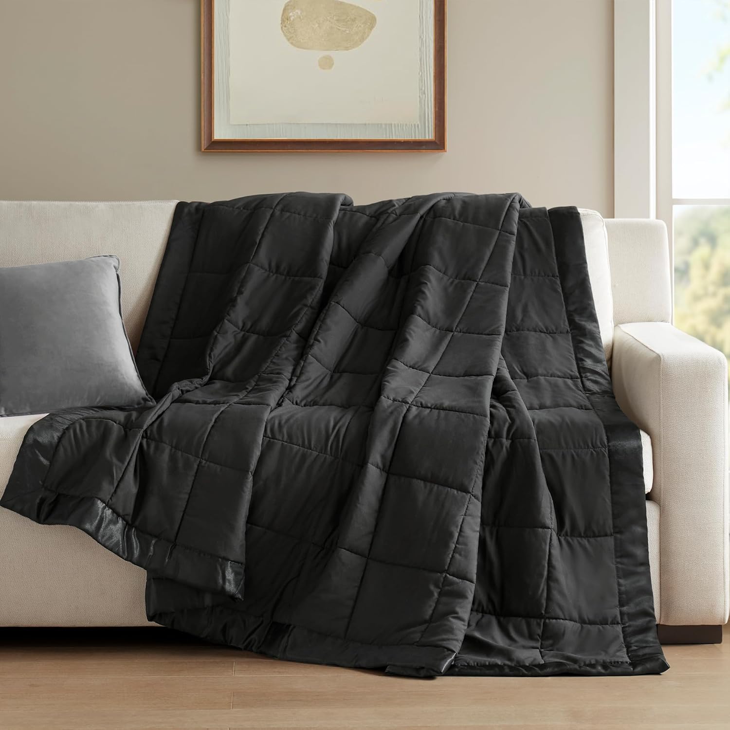 Coperta leggera morbida della collezione Windom con bordo in raso