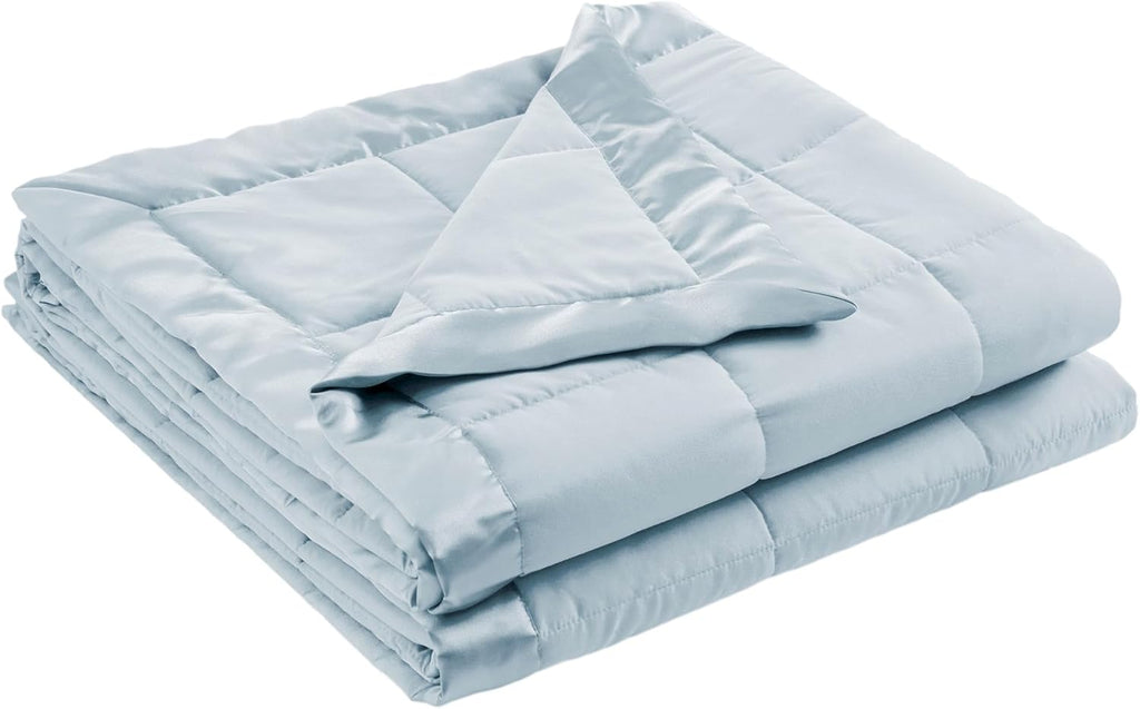 Coperta leggera morbida della collezione Windom con bordo in raso