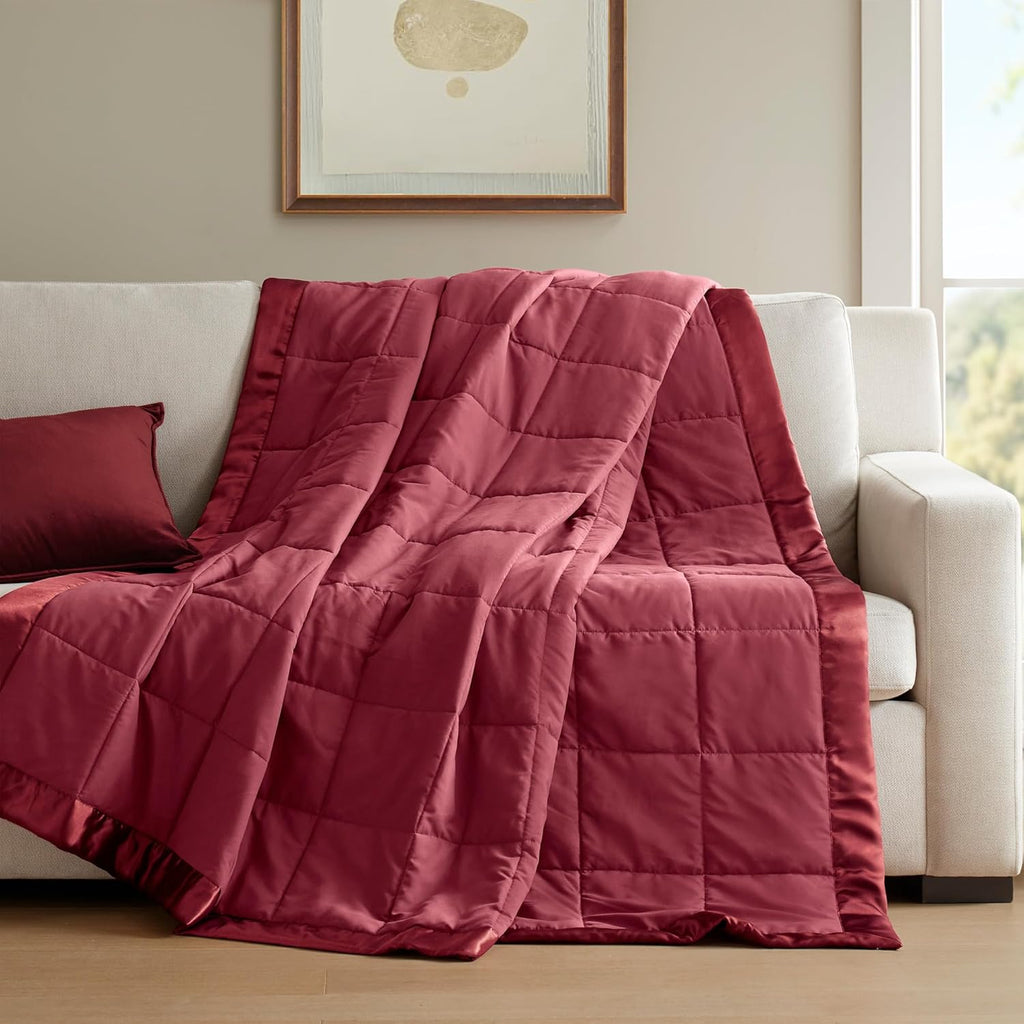 Coperta leggera morbida della collezione Windom con bordo in raso