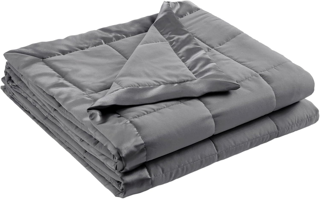 Coperta leggera morbida della collezione Windom con bordo in raso