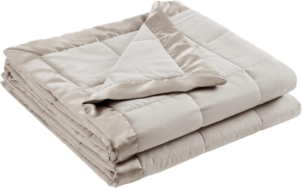 Coperta leggera morbida della collezione Windom con bordo in raso