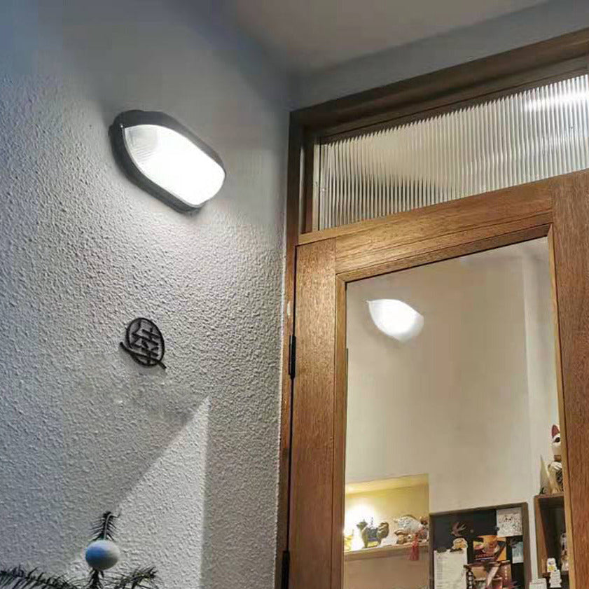 Oval udendørs væglampe i ribbet glas, sort, industriel bulkhead | Ormexis