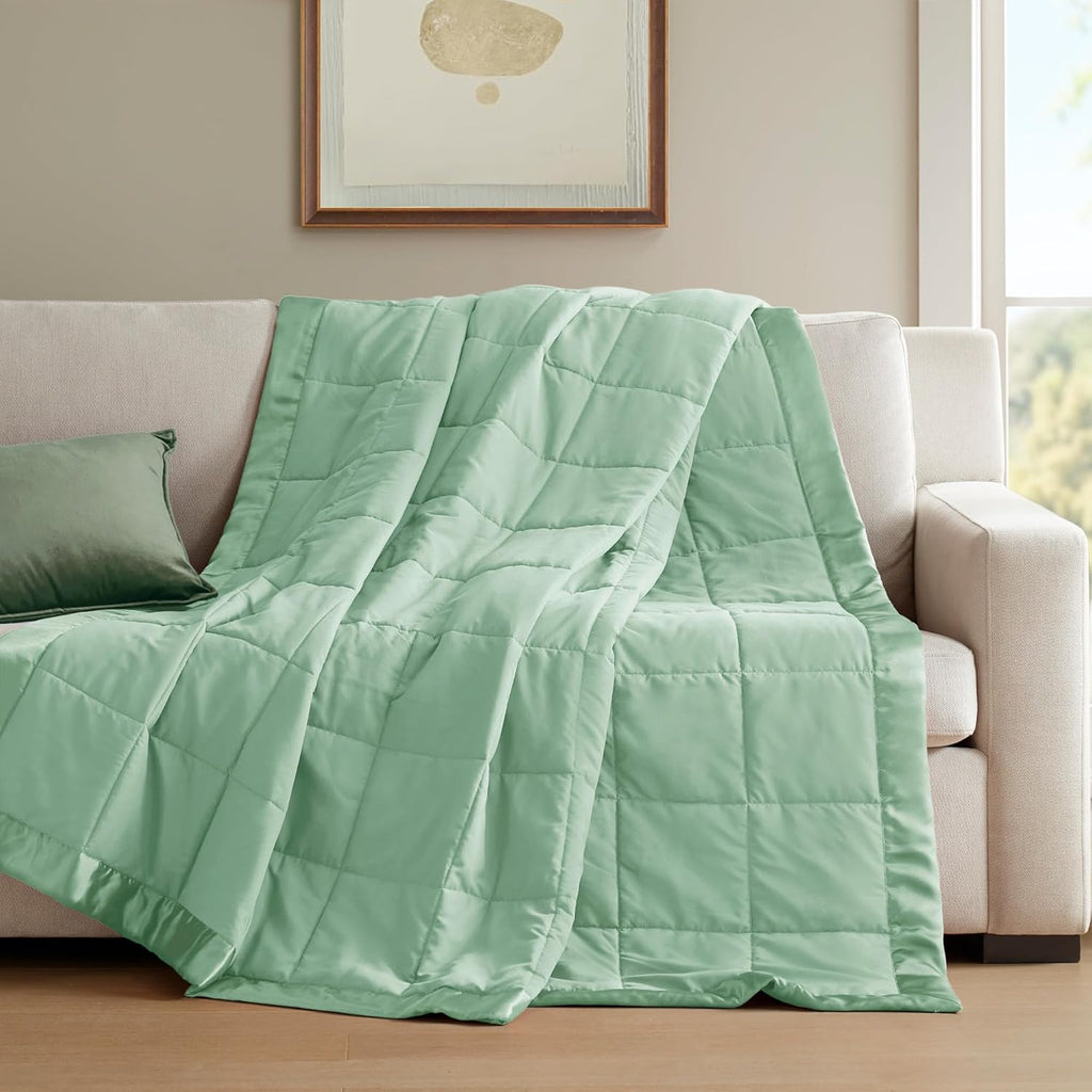 Coperta leggera morbida della collezione Windom con bordo in raso
